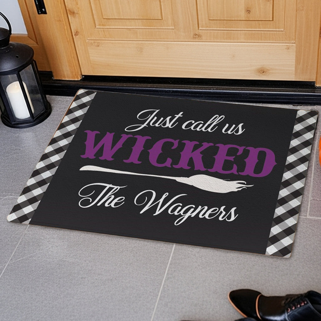 Personalized halloween doormat with black and white checkered border and custom family name design