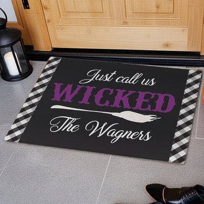 Personalized halloween doormat with black and white checkered border and custom family name design