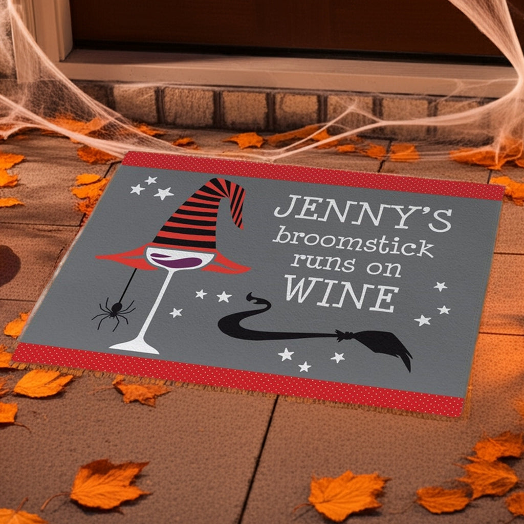 Personalized halloween doormat with witch hat, wine glass, spider, and broomstick design