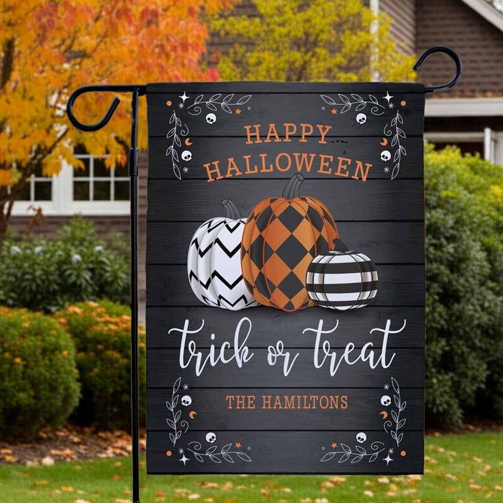 Halloween garden flag customized with black wood background three patterned pumpkins Happy Halloween trick or treat family name