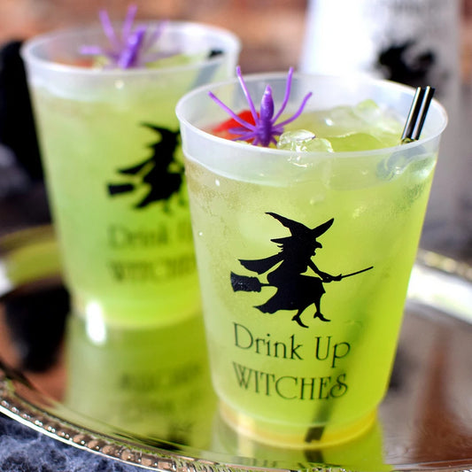 Clear frosted 16 oz. halloween party cups personalized with witch and broom design and 2 lines of custom text in black print