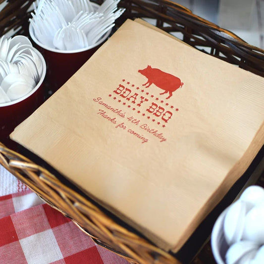 Natural color kids birthday dinner napkins personalized with bday bbq design and 2 lines of text in red print