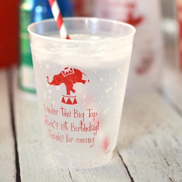 Clear frosted kids birthday party cup personalized with circus elephant design and 3 lines of custom text in red print