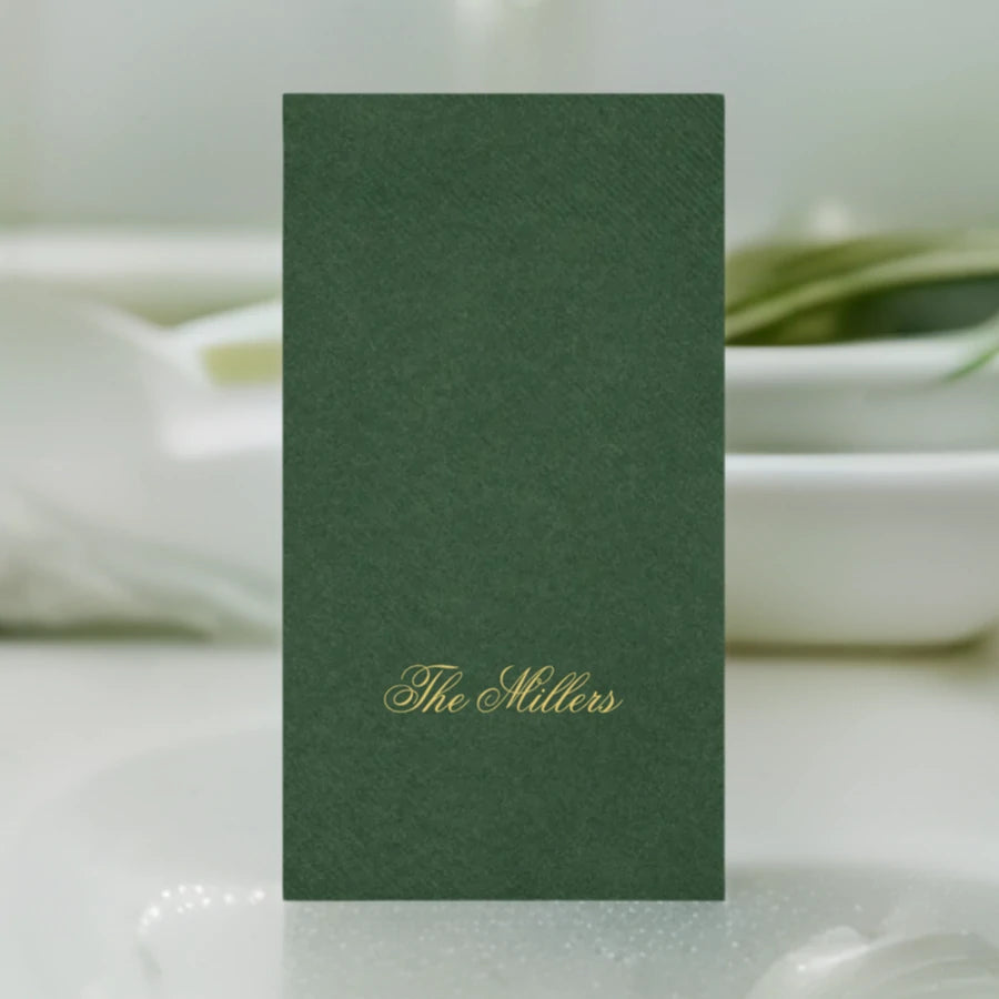 green color disposable linen like guest towel personalized with 1 line of custom text in gold print on bathroom vanity