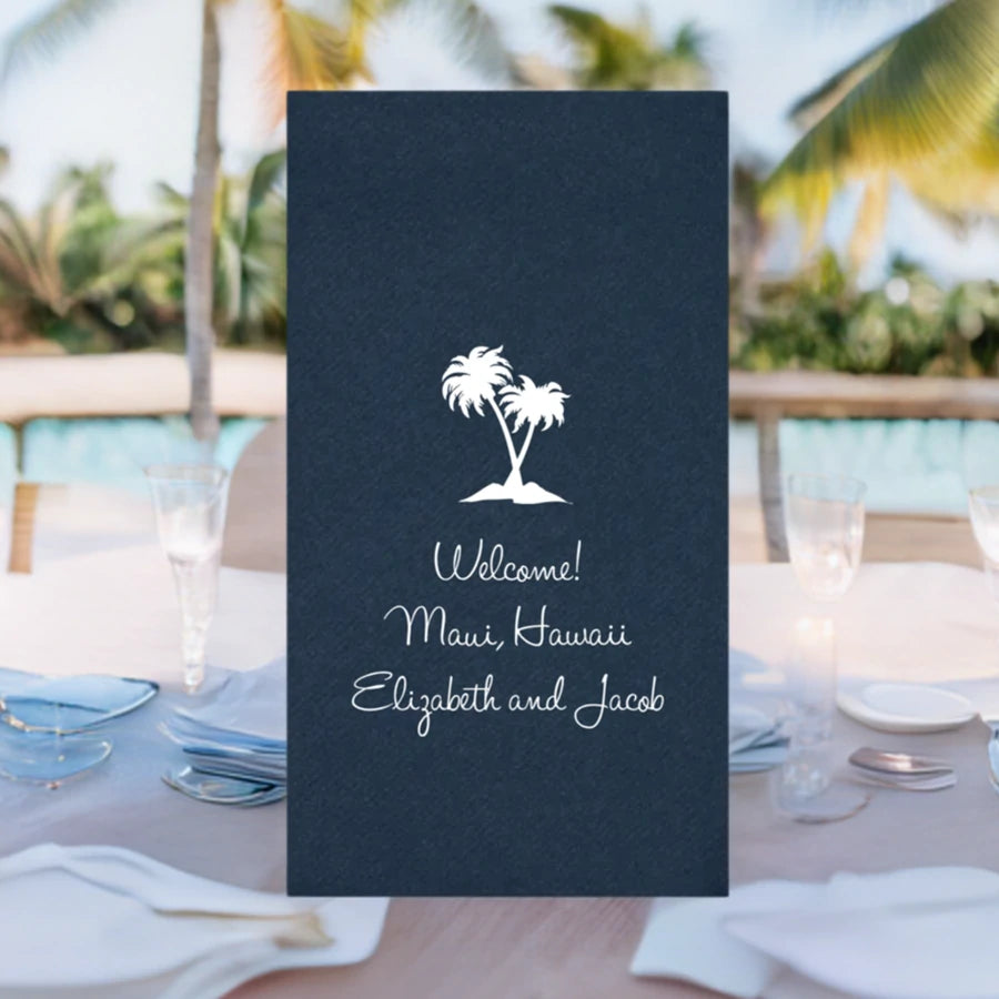 skipper blue color disposable linen feel guest hand towel personalized with palm trees design and 3 lines of text in white print for destination wedding