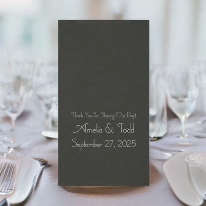 umbra grey color disposable linen feel guest towel personalized with 3 lines of custom text in silver print on wedding dinner table