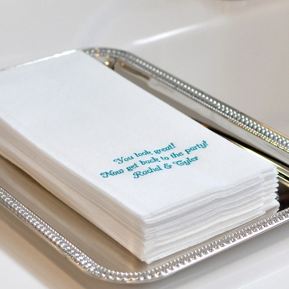 personalized white color fine linen look wedding guest hand towels in silver serving tray on restroom vanity