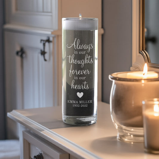 Personalized memorial candle with engraved message and name Emma Miller displayed on white furniture