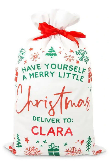 Closeup of have yourself a merry little Christmas Santa gift bag personalized with childs name