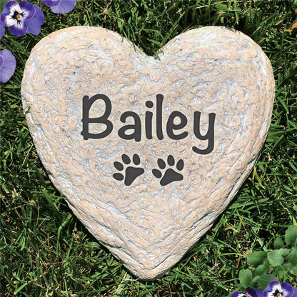 Heart-shaped garden stone personalized pet memorial stone with name Bailey and paw prints