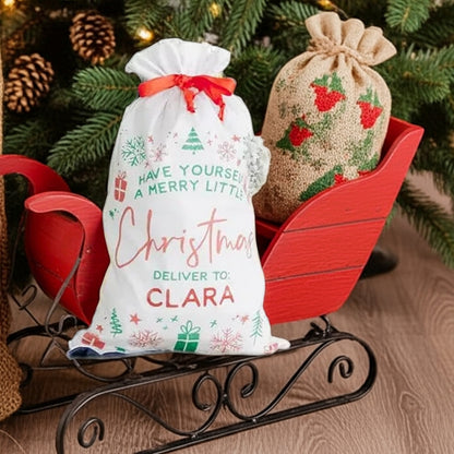Personalized Santa gift sack with holiday design and red ribbon, perfect for gifting