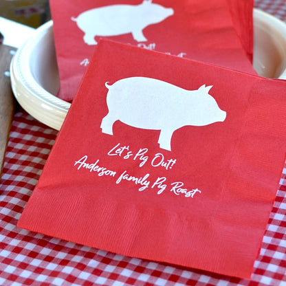 Red color summer picnic luncheon napkins personalized with pig design and 2 lines of text in white print for family pig roast