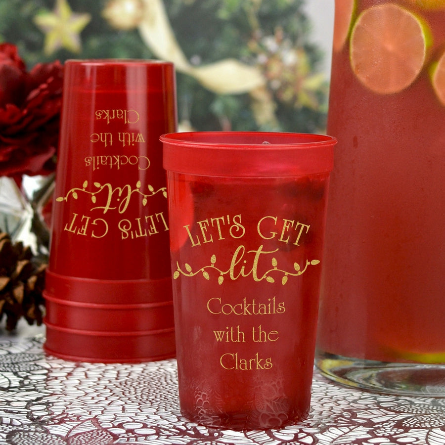 Translucent red 22 Oz. tall stadium cups personalized with 'Let's Get Lit' Christmas design and 3 lines of custom text in gold imprint color