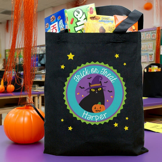 Personalized trick or treat bag black tote with Halloween cat and pumpkin design named Harper for candy