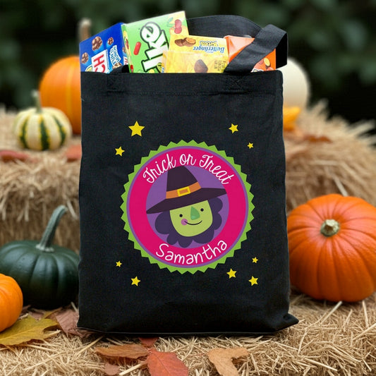 Black canvas personalized trick or treat bag with smiling witch name badge Samantha filled with candy