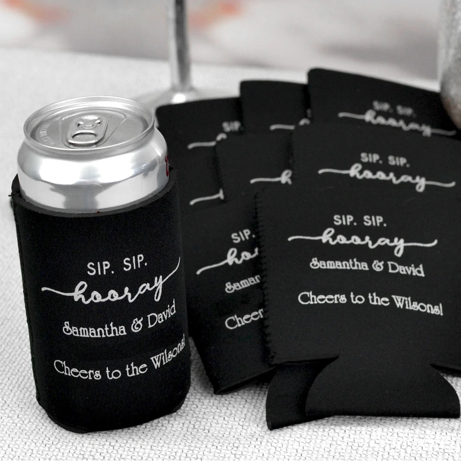 Black wedding can coolers personalized with sip sip hooray design and 2 lines of custom text in white print