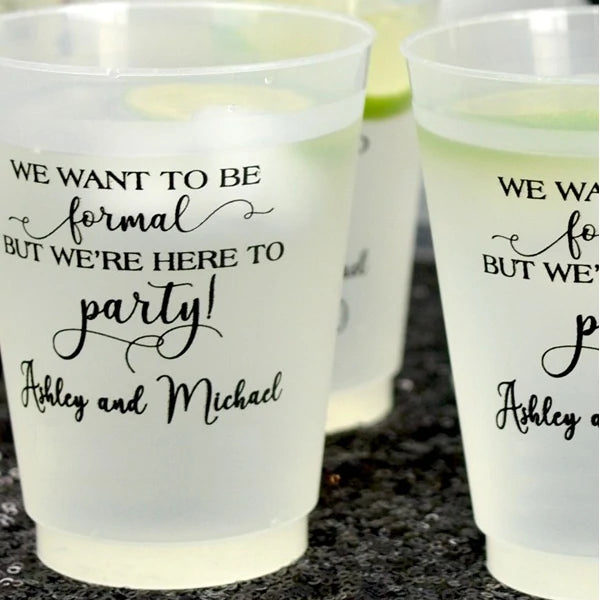 Clear frosted 16 oz. cocktail cups personalized with here to party design and bride and groom name in black print