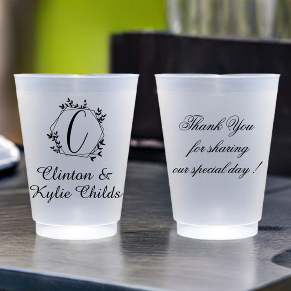 Personalized wedding cups featuring elegant script with names and a thank you message for guests