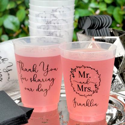 https://tippytoad.com/cdn/shop/files/personalized-wedding-drink-cups-shatterproof-16-ounce-frosted-mr-mrs-wreath.webp?v=1703076087&width=416