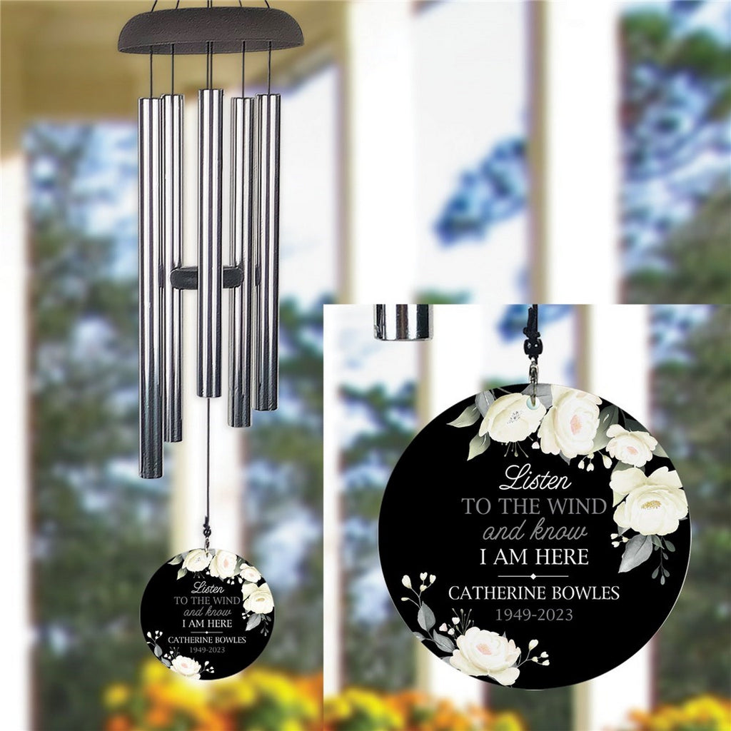Personalized wind chime memorial with white floral design and custom engraved message
