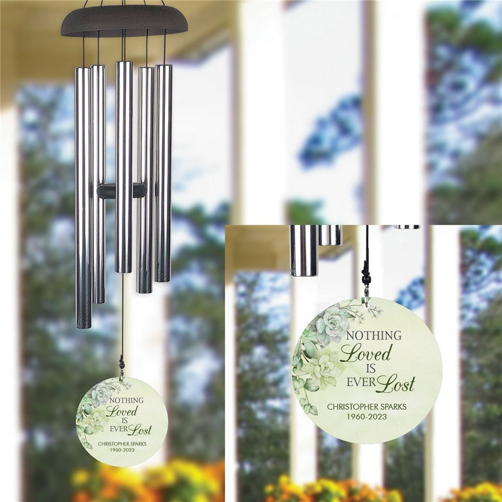 Personalized wind chime memorial with engraved round pendant and floral design
