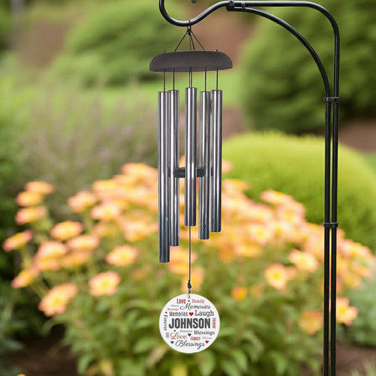 Personalized wind chime with metal tubes and custom name wind sail hanging outdoors