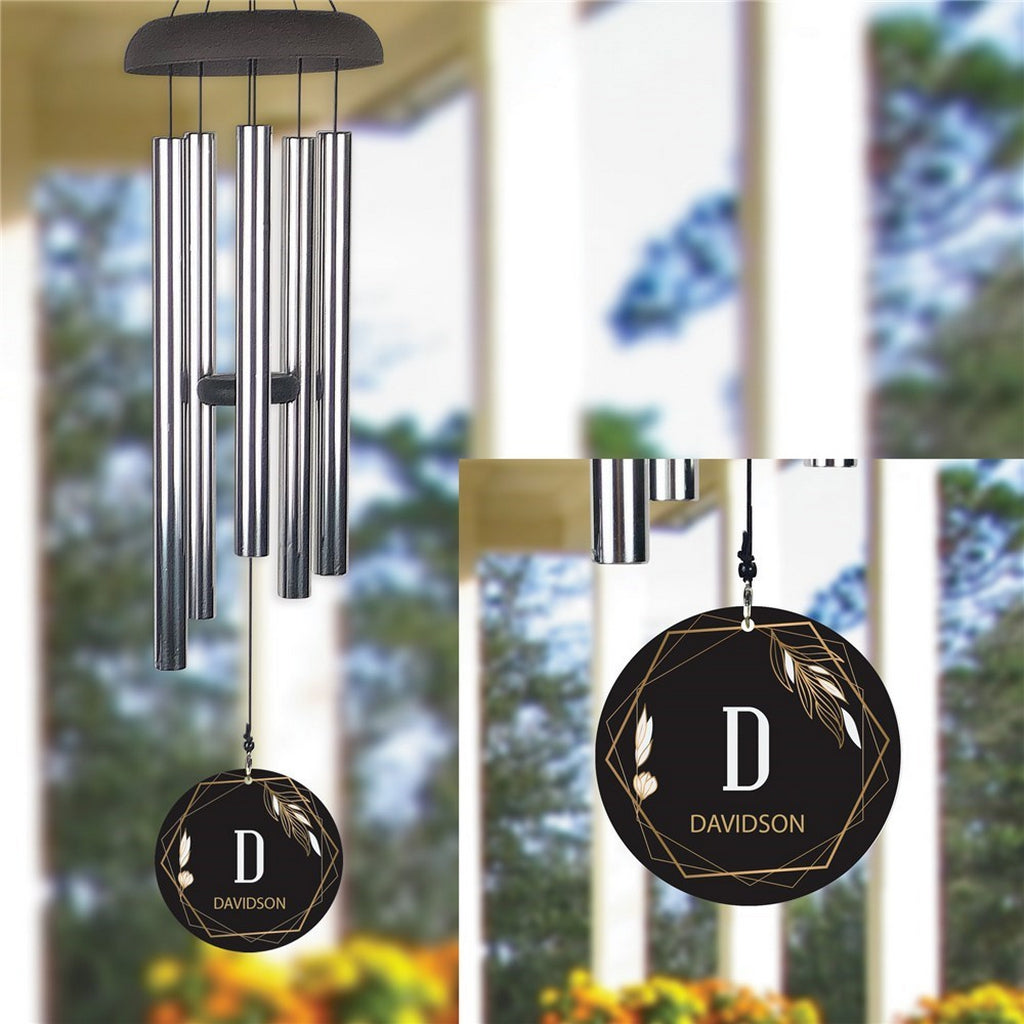 Personalized wind chime with engraved Davidson monogram and decorative metal leaves
