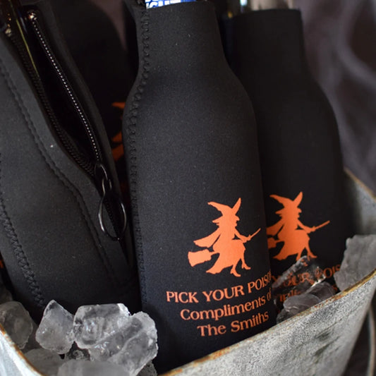 Black neoprene zip-up Halloween bottle sleeves personalized with flying witch design and 3 lines of custom text in orange print