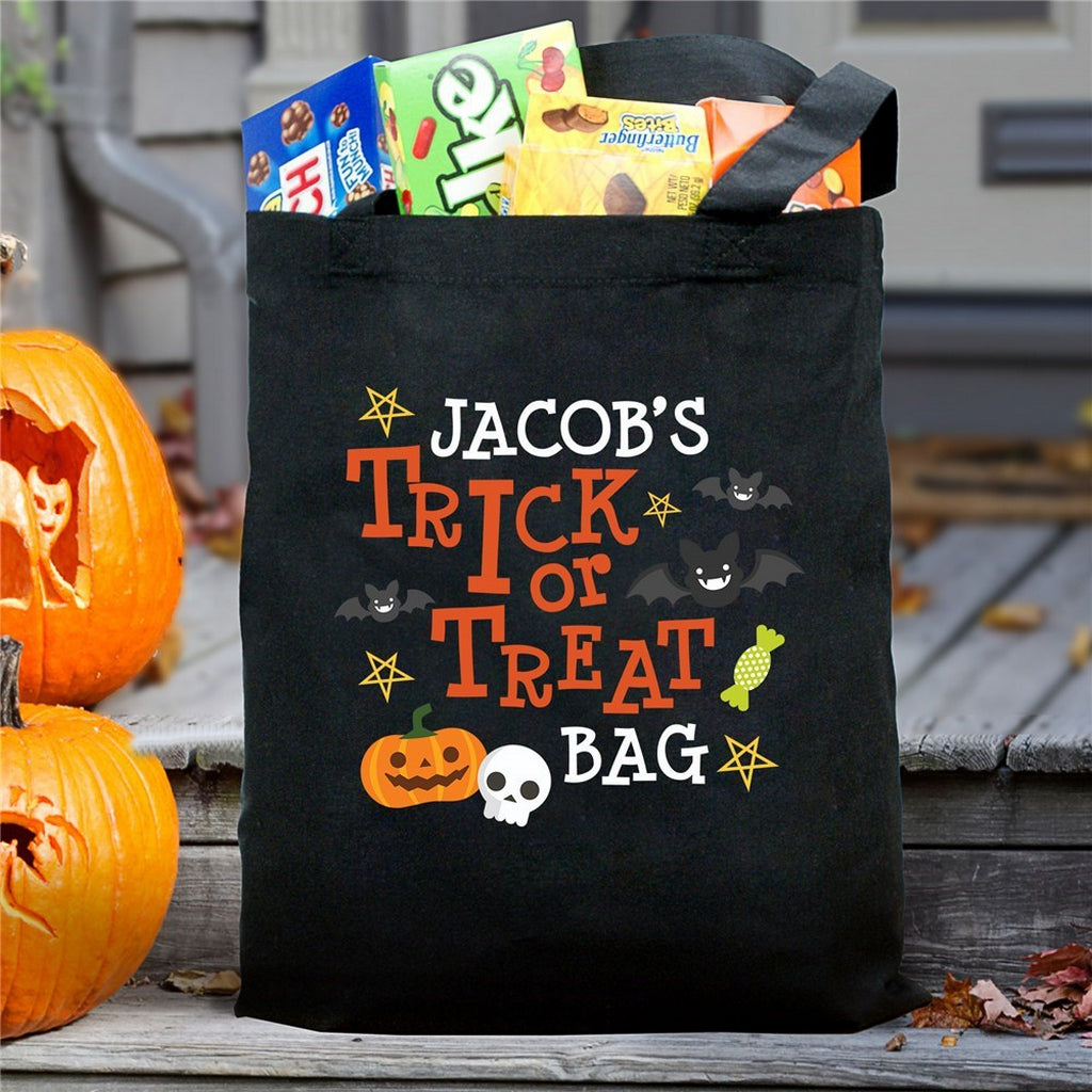 Black Halloween tote with Jacobs name pumpkin skull and bats personalized trick or treat bag filled with candy