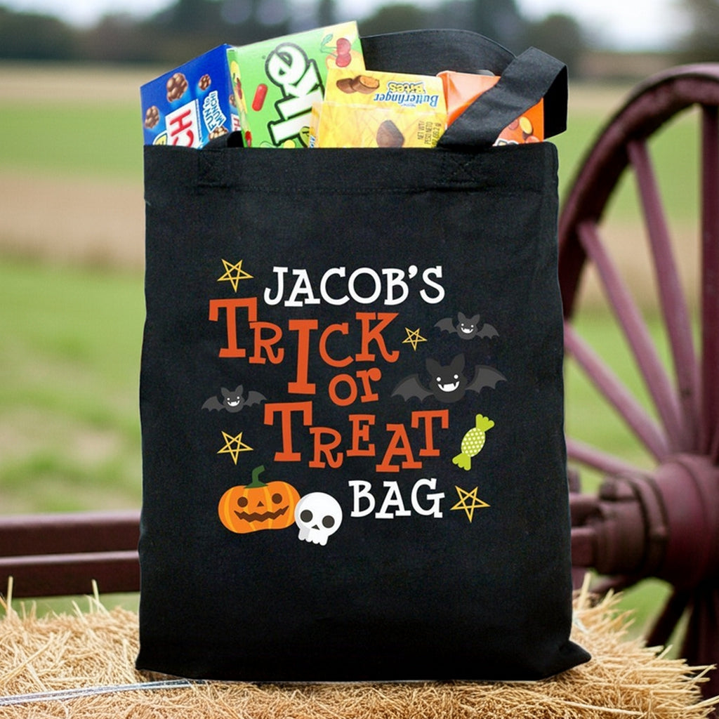 Black trick or treat tote with pumpkin skull and bats personalized trick or treat bag design filled with candy