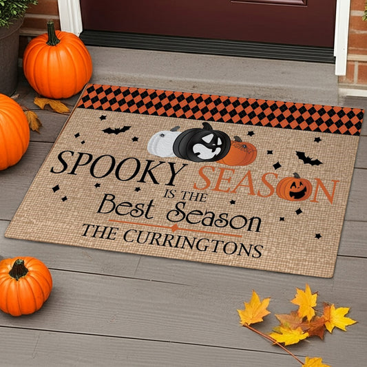 Pumpkins bats personalized doormat with spooky season text and black and orange checkered border