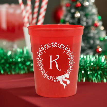 Personalized red Christmas party stadium cups with festive wreath design for holiday celebrations