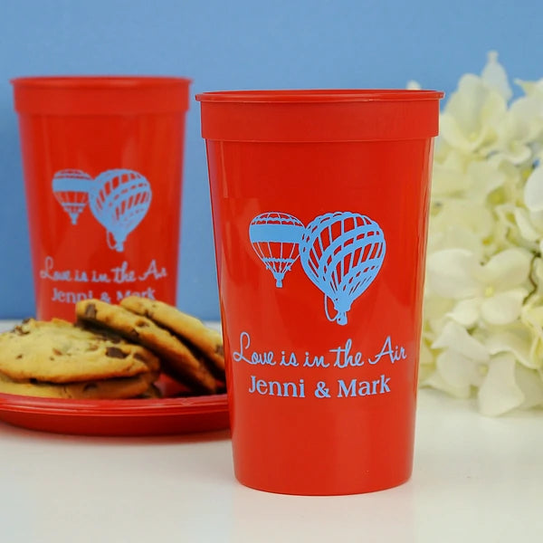 Red 22 oz. stadium wedding cups personalized with hot air baloons design and 2 lines of custom text in powder blue print