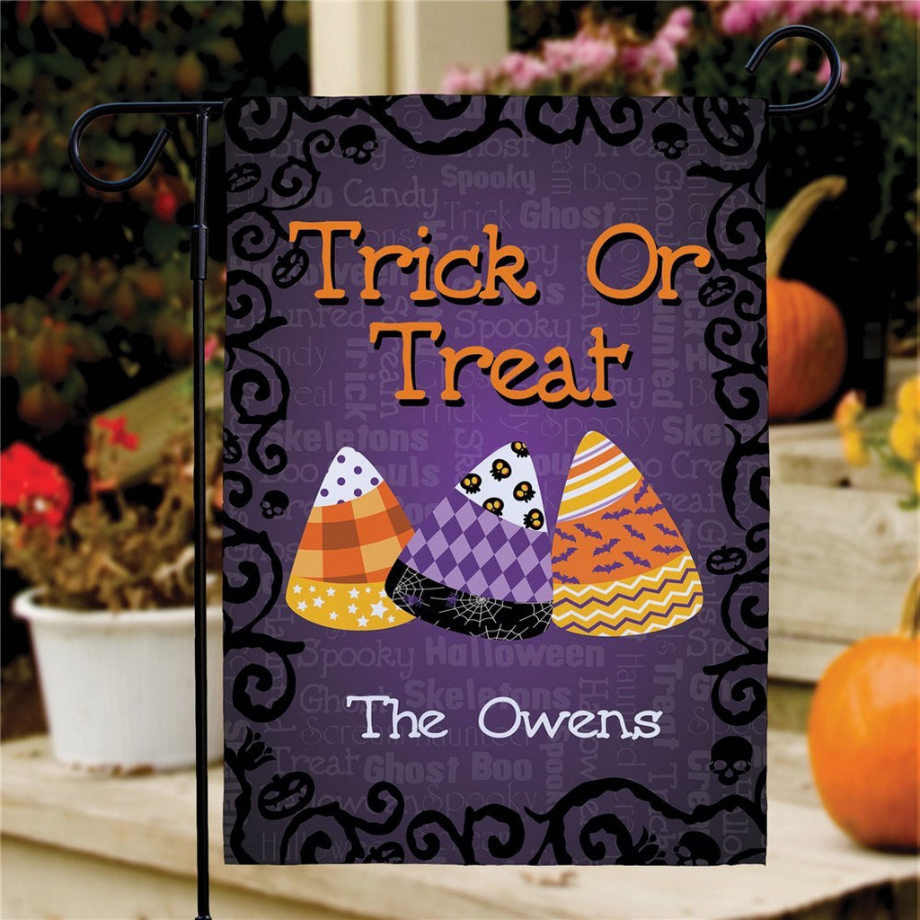 Halloween garden flag personalized with Trick Or Treat design with candy corn trio and The Owens