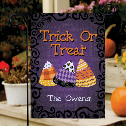 Halloween garden flag personalized with Trick Or Treat design with candy corn trio and The Owens