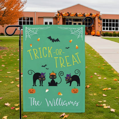 Halloween garden flag green Trick or Treat design with three black cats bats candy corn pumpkins and The Williams