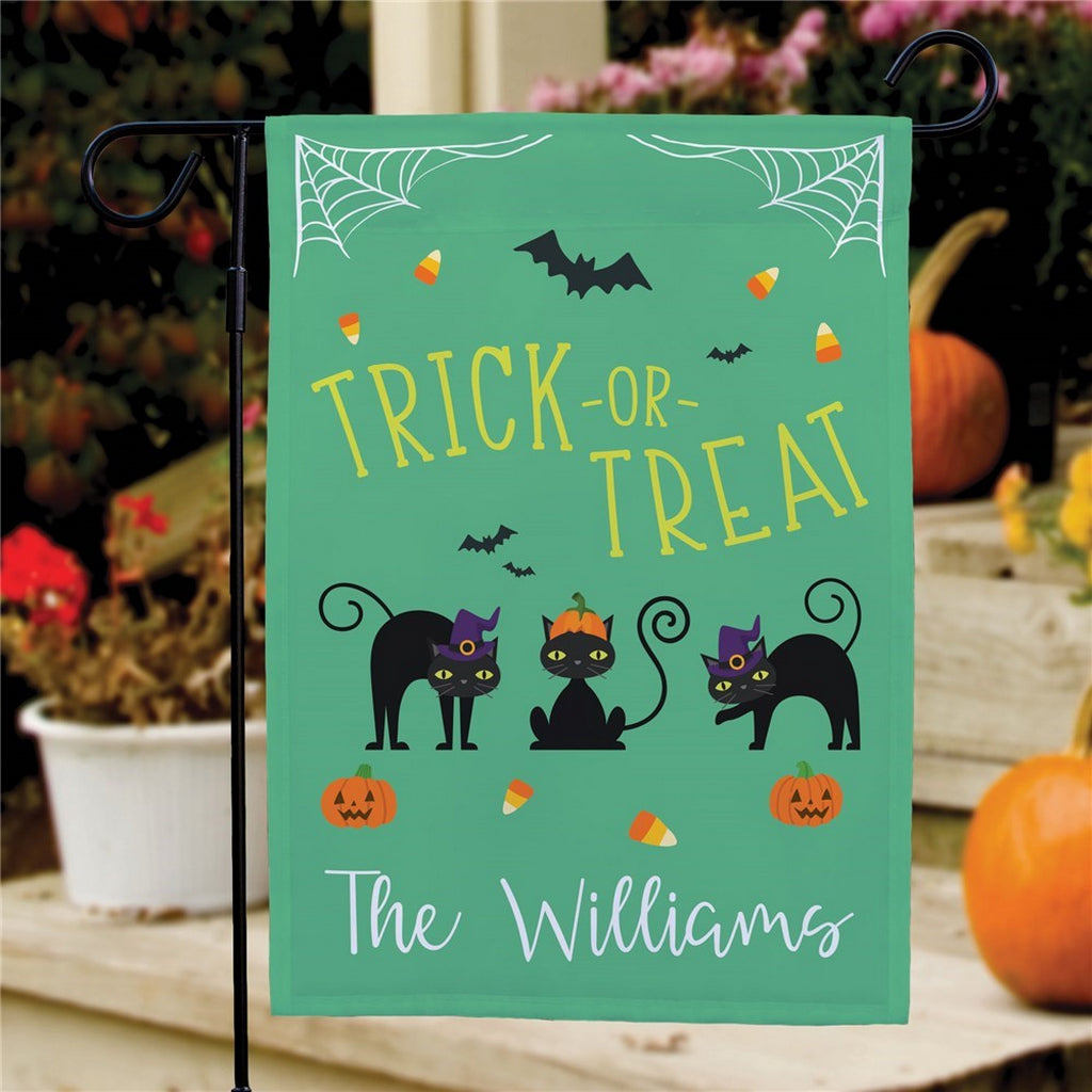 Halloween garden flag with green Trick or Treat design featuring three black cats bats candy corn and personalized Williams