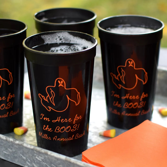 Custom halloween party stadium cups in 22 oz size personalized with ghost design and custom text in orange print