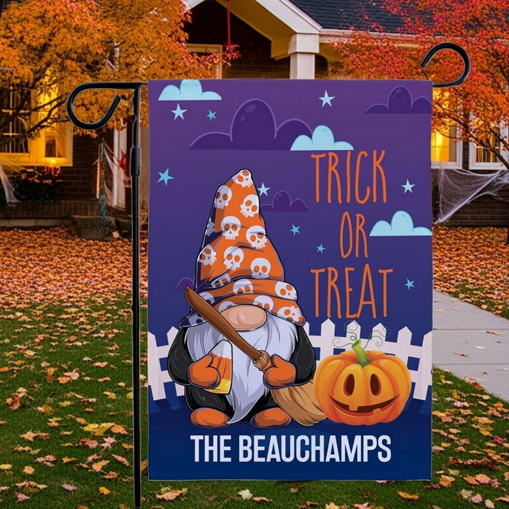 Halloween garden flag showing a gnome in a skull hat holding a broom and pumpkin with Trick or Treat text custom The Beauchamps