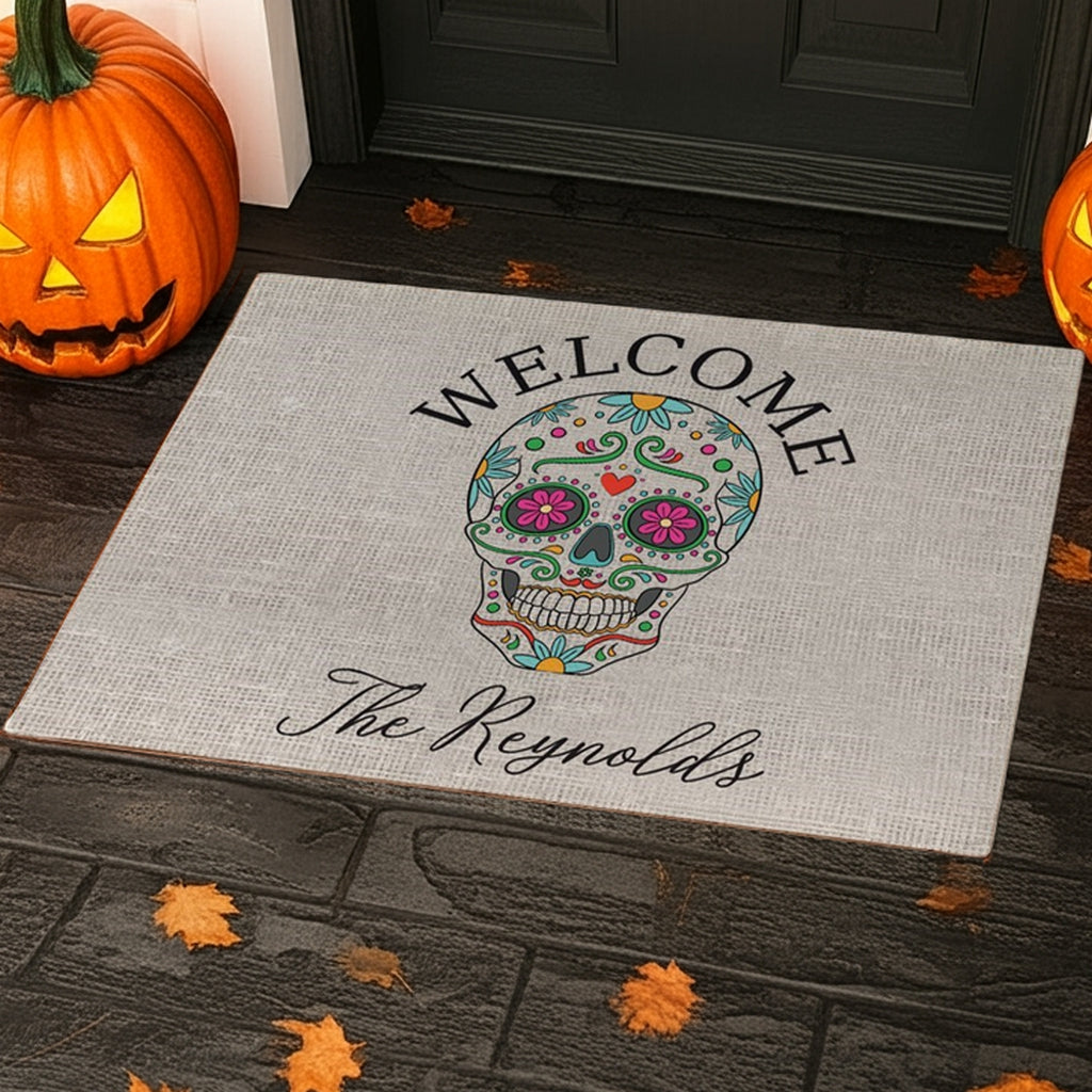 Sugar skull personalized doormat with welcome text and custom family name in front of door