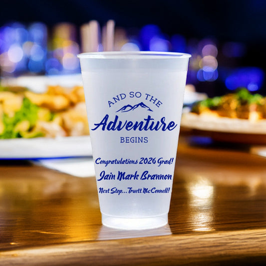 Frosted plastic cup personalized with "The Adventure Begins" design and text "Congratulations 2026 grad!, [Graduate Name], "Next Stop.. [School Name]" in blue print