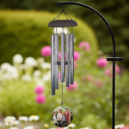 Wind chime personalized with photo wind sail hanging from tree branch outdoors