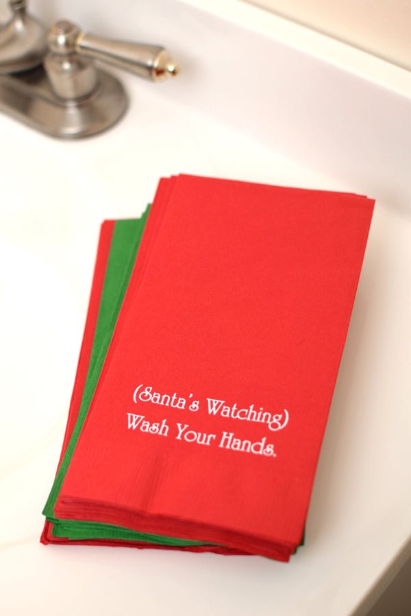 Red 1/8 inch fold paper guest hand towels personalized with two lines of custom text in white imprint color for Christmas bathroom hand towels